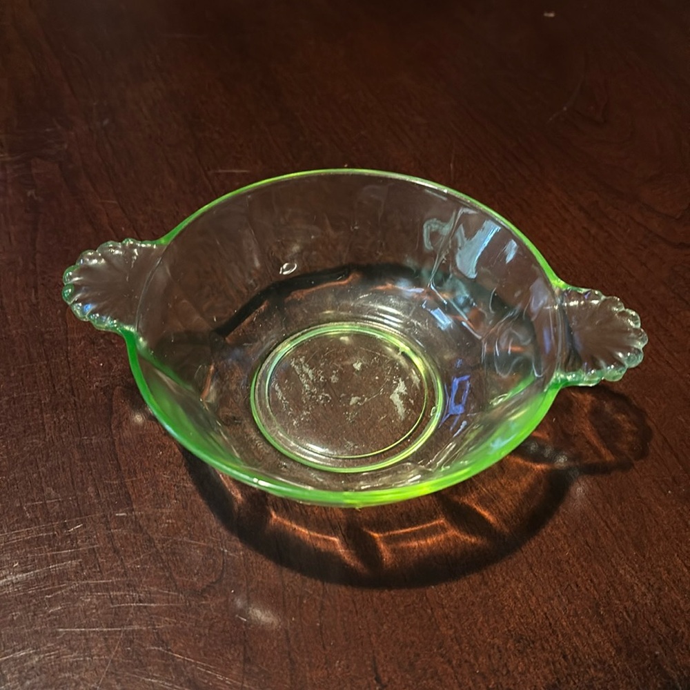 Small green depression glass scalloped bowl with seashell handles